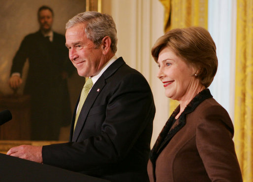 President George W. Bush is joined by Mrs. Laura Bush in the East Room of the White House, Friday, Nov. 16, 2007, in an address to invited guests in celebration of National Adoption Day. President Bush, in speaking to parents and children, said he was "So thankful that the parents and children here today have found the gift of one another. And I encourage our citizens across the land to explore adoption, look into the joys of adoption, and provide love for somebody who needs it." White House photo by Joyce N. Boghosian