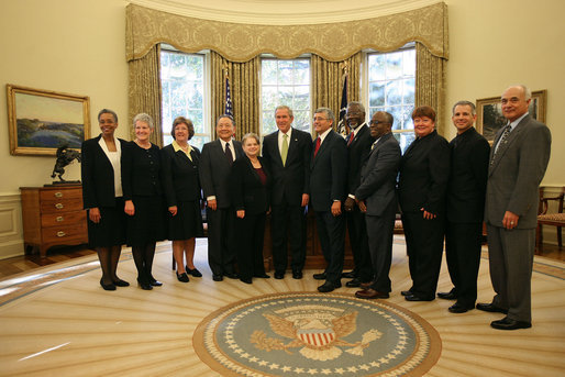 Presidents George W. Bush stands with the recipients of the 2006 Presidential Awards for Excellence in Science, Mathematics, and Engineering Mentoring Friday, Nov. 16, 2007, in the Oval Office. White House photo by Joyce N. Boghosian