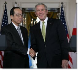 President George W. Bush and Prime Minister Yasuo Fukuda of Japan exchange handshakes following their joint statement Friday, Nov. 16, 2007, at the White House. White House photo by Chris Greenberg