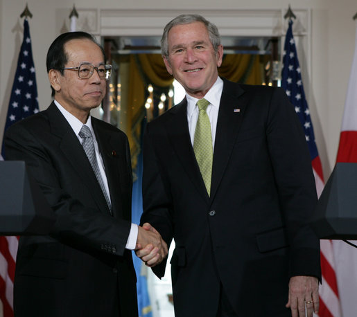 President George W. Bush and Prime Minister Yasuo Fukuda of Japan exchange handshakes following their joint statement Friday, Nov. 16, 2007, at the White House. White House photo by Chris Greenberg