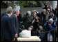 President George W. Bush stands over May, the 2007 National Thanksgiving Turkey, as the turkey becomes the center of focus for the White House media during the Pardoning of the National Thanksgiving Turkey Tuesday, Nov. 20, 2007, in the Rose Garden of the White House. White House photo by Joyce N. Boghosian