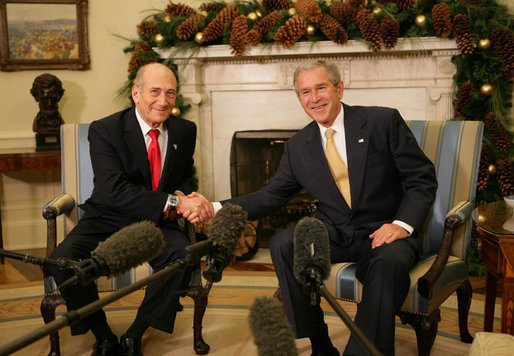 President George W. Bush shakes hands with Prime Minister Ehud Olmert of Israel in the Oval Office Monday, Nov. 26, 2007. In welcoming his fellow leader to the White House, the President said, "Thanks for coming to the Annapolis Conference. I'm looking forward to continuing our serious dialogue with you and the President of the Palestinian Authority to see whether or not peace is possible. I'm optimistic, I know you're optimistic, and I want to thank you for your courage and your friendship." White House photo by Eric Draper