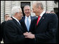 President George W. Bush congratulates President Mahmoud Abbas, left, of the Palestinian Authority, and Prime Minister Ehud Olmert of Israel following their agreement Tuesday, Nov. 27, 2007, to immediately resume long-stalled peace talks. The agreement came during the Annapolis Conference held in Annapolis, Maryland. White House photo by Chris Greenberg