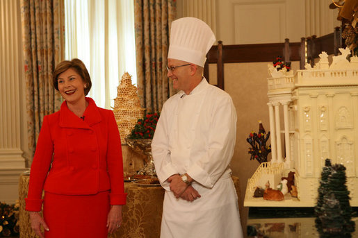 Laura Bush stands with White House Pastry Chef Bill Yosses during the press preview Thursday, Nov. 29, 2007, in the State Dining Room. They discussed the gingerbread White House. Based on a foundation of gingerbread, the structure consists of 300 pounds of white chocolate and gingerbread. White House photo by Shealah Craighead