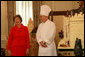 Laura Bush stands with White House Pastry Chef Bill Yosses during the press preview Thursday, Nov. 29, 2007, in the State Dining Room. They discussed the gingerbread White House. Based on a foundation of gingerbread, the structure consists of 300 pounds of white chocolate and gingerbread. White House photo by Shealah Craighead