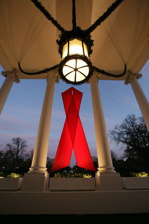 A red ribbon adorns the North Portico of the White House Friday, Nov. 30, 2007, in recognition of World AIDS Day and the commitment by President George W. Bush and his administration to fighting and preventing HIV/AIDS in America and the world. White House photo by Eric Draper