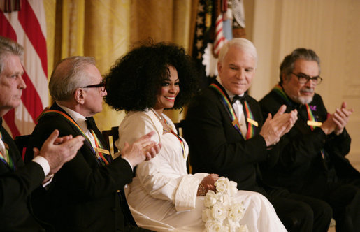 Singer Diana Ross is applauded by her fellow Kennedy Center honorees as she is recognized for her achievements by President George W. Bush in the East Room of the White House Sunday, Dec. 2, 2007, during the Kennedy Center Gala Reception. From left are singer, songwriter Brian Wilson; filmmaker Martin Scorsese; comedian, actor and author Steve Martin and pianist Leon Fleisher. White House photo by Shealah Craighead