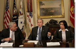 President George W. Bush is joined by Walter Isaacson, President and CEO, Aspen Institute, and Tahani Abu Daqqa, Palestinian Minister of Youth and Sports, during a meeting Monday, Dec. 3, 2007, with U.S.-Palestinian Public-Private Partnership in the Roosevelt Room of the White House. The partnership is aimed at promoting economic opportunity and leadership development for Palestinian youth. White House photo by Eric Draper