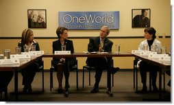 President George W. Bush participates in a meeting on health care Wednesday, Dec. 5, 2007, during a visit to the OneWorld Community Health Centers, Inc. in Omaha. Said the President afterwards, "This center serves -- 85 percent of its people don't speak English as a first language. By far, the vast majority are low-income. And yet they're receiving first-class quality care. So I thank the docs and the nurses and the social workers, and all the people who are making this facility such a good one."  White House photo by Chris Greenberg