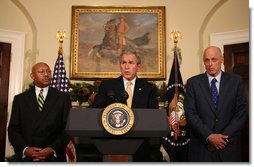 President George W. Bush is flanked by Secretary Alphonso Jackson, left, of the Department of Housing and Urban Development, and Secretary Hank Paulson of the Department of the Treasury, as he delivers a statement Thursday, Dec. 6, 2007, at the White House, on the Administration's efforts on housing. White House photo by Joyce N. Boghosian