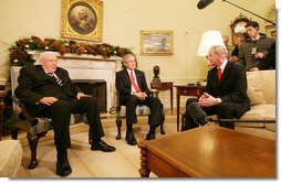 President George W. Bush shares a moment with Ian Paisley, left, First Minister of Northern Ireland, and Martin McGuinness, Deputy First Minister of Northern Ireland, during their visit Friday, Dec. 7, 2007, to the Oval Office. White House photo by Chris Greenberg