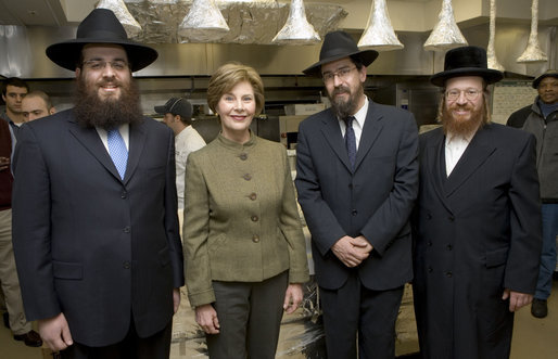 Mrs. Laura Bush joins Rabbi Mendel Minkowitz, left, Rabbi Hillel Baron and Rabbi Binyomin Taub, right, during the koshering of the White House kitchen Monday, Dec. 10, 2007, in anticipation of Monday night's lighting of the Menorah and Hanukah reception. White House photo by Chris Greenberg