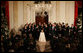 Tenor Alberto Mizrahi, the cantor at Chicago's historic Anshe Emet Synagogue, is joined by the Zamir Chorale as they entertain during the lighting of the Menorah Monday, Dec. 10, 2007, in the Grand Foyer of the White House. White House photo by Joyce N. Boghosian