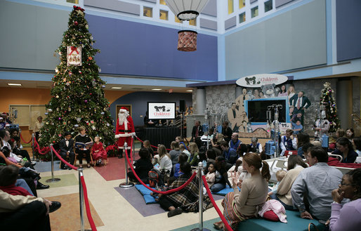 Mrs. Laura Bush reads "Rudolph the Red Nosed Reindeer" to children at the Children's National Medical Center in Washington, D.C., Wednesday, Dec. 12, 2007, following a tour of the Surgical Care Unit where she visited with young patients. White House photo by Shealah Craighead