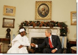 President George W. Bush shakes hands with President Umaru Yar'Adua of Nigeria, as he welcomes him to the Oval Office Thursday, Dec. 13, 2007, at the White House. Said President Bush, "Mr. President, I am impressed by your commitment to reform, your adherence to the concept of rule of law, and your belief in transparency. And I congratulate you for being a strong leader." White House photo by Joyce N. Boghosian