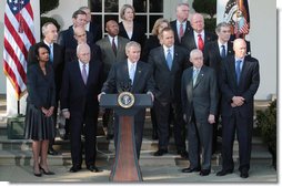 President George W. Bush, joined by Vice President Dick Cheney and members of his Cabinet, addresses reporters in the Rose Garden at the White House, Friday, Dec. 14, 2007, where President Bush congratulated the Senate for passing a good energy bill, and urged Congress to move forward with spending legislation to fund the day to day operations of the federal government. White House photo by Eric Draper