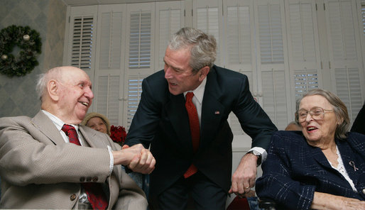 President George W. Bush pauses with residents of the Little Sisters of the Poor Tuesday, Dec. 18, 2007, in Washington, D.C. The Congregation of the Little Sisters of the Poor was founded in France in 1839, and today, Little Sisters care for the aged poor in 31 countries around the world. White House photo by Chris Greenberg