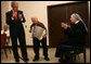 President George W. Bush and Sister Therese Noel join the festivities as they listen to 75-year-old resident Joe Dignazio of West Virginia, play "The Eyes of Texas" during a visit Tuesday, Dec. 18, 2007, to the Washington, D.C. facility. The President told Mr. Dignazio, "You are really good! Keep playing!" White House photo by Shealah Craighead