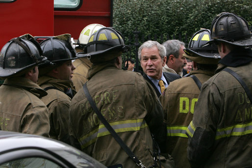 President George W. Bush thanks firefighters from the District of Columbia after they battled an early morning blaze Wednesday, Dec. 19, 2007, at the Eisenhower Executive Office Building on the White House complex. White House photo by Chris Greenberg