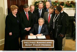 President George W. Bush signs into law H.R. 3648, the Mortgage Forgiveness Debt Relief Act of 2007, during ceremonies Thursday, Dec. 20, 2007, in the Roosevelt Room of the White House. White House photo by Eric Draper