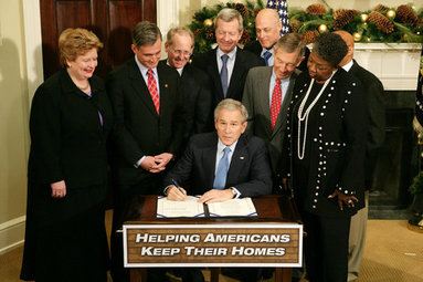 President George W. Bush signs into law H.R. 3648, the Mortgage Forgiveness Debt Relief Act of 2007, during ceremonies Thursday, Dec. 20, 2007, in the Roosevelt Room of the White House. White House photo by Eric Draper