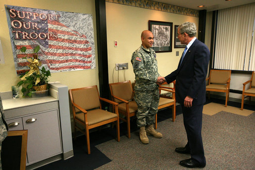 President George W. Bush presents the Purple Heart medal to US Army PFC Jeddah DeLoria of Chosen, Colo., Thursday, Dec. 20, 2007 at the Walter Reed Army Medical Center in Washington, D.C. DeLoria is recovering from injuries sustained in Operation Enduring Freedom in Afghanistan. White House photo by Joyce N. Boghosian