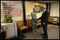 President George W. Bush presents the Purple Heart medal to US Army PFC Jeddah DeLoria of Chosen, Colo., Thursday, Dec. 20, 2007 at the Walter Reed Army Medical Center in Washington, D.C. DeLoria is recovering from injuries sustained in Operation Enduring Freedom in Afghanistan. White House photo by Joyce N. Boghosian