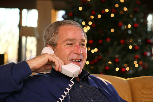 President George W. Bush makes Christmas Eve telephone calls to members of the Armed Forces at Camp David, Monday, Dec. 24, 2007. White House photo by Eric Draper