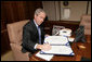 President George W. Bush signs into law H.R. 2764, the Consolidated Appropriations Act 2008, also known at the omnibus, making appropriations for the Department of State, foreign operations, and related programs for the fiscal year ending September 30, 2008, and for other purposes, after boarding Air Force One Wednesday, Dec. 26, 2007. White House photo by Chris Greenberg