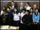 President George W. Bush is joined by Principal Carlos Azcoitia, left; teacher Rene Camler and Chicago Mayor Richard M. Daley, right, Monday, Jan. 7, 2008, during a visit with students and staff at the Horace Greeley Elementary School in Chicago. White House photo by Joyce N. Boghosian