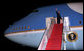 President George W. Bush waves as he boards Air Force One Tuesday, Jan. 8, 2008, at Andrews Air Force Base, en route to an eight-day visit in the Mideast. White House photo by Eric Draper