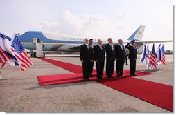 President George W. Bush is joined on the red carpet by Israel’s Prime Minister Ehud Olmert, right, President Shimon Peres, second from left, and Ambassador Yitzhak Eldan, Israel’s Chief of Protocol, after arriving Wednesday, Jan. 9, 2008, in Tel Aviv for the first stop of his Mideast visit.  White House photo by Eric Draper