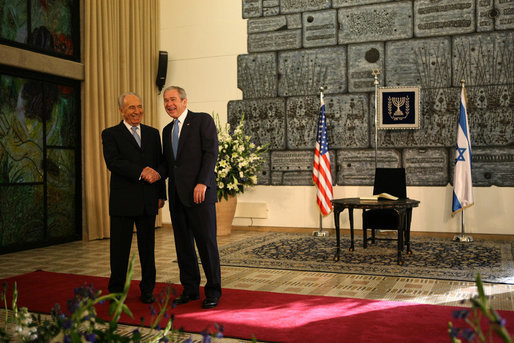 President George W. Bush and President Shimon Peres of Israel shake hands after meeting Wednesday, Jan. 9, 2008, at the Israeli President’s residence in Jerusalem. White House photo by Eric Draper