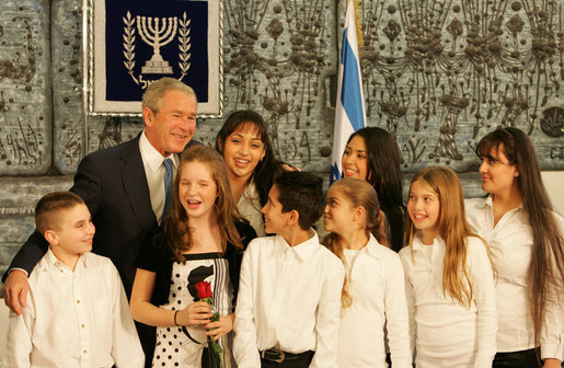 President George W. Bush poses with singers Wednesday, Jan. 9, 2008, at the President’s Residence in Jerusalem, where he met with his Israeli counterpart Shimon Peres. White House photo by Chris Greenberg