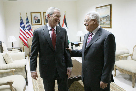 President George W. Bush and President Mahmoud Abbas of the Palestinian Authority share a moment before their joint press availability Thursday, Jan. 10, 2008, in Ramallah. White House photo by Eric Draper