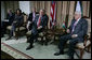 President George W. Bush and President Mahmoud Abbas of the Palestinian Authority, pause for photographs before the start of their expanded meeting Thursday, Jan. 10, 2008, at the President’s Ramallah residence. With them are, from left: U.S. National Security Adviser Stephen Hadley, Secretary of State Condoleezza Rice, and Gamal Helal, White House Interpreter. White House photo by Chris Greenberg