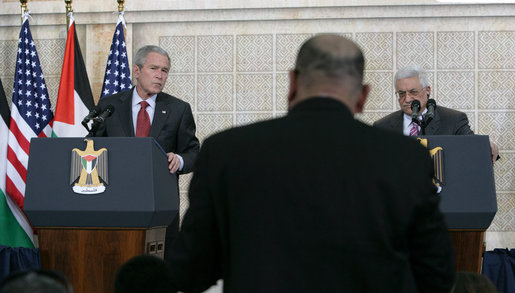 President George W. Bush and President Mahmoud Abbas of the Palestinian Authority, listen to a reporter’s question Thursday, Jan. 10, 2008, during a joint press availability at in Ramallah. White House photo by Chris Greenberg