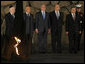 President George W. Bush pauses to pay respects in the Hall of Remembrance Friday, Jan. 11, 2008, at Yad Vashem, the Holocaust Museum in Jerusalem. With him, from left, are: Josef Lapid, Chairman of the Yad Vashem Council; Israel’s President Shimon Peres, Israel’s Prime Minister Ehud Olmert, and Avner Shalev, Chairman of the Yad Vashem Directorate. White House photo by Eric Draper