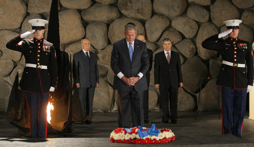 President George W. Bush pays his respect to the victims of the Holocaust during a visit Friday, Jan. 11, 2008, to Yad Vashem, the Holocaust Museum in Jerusalem. The President made the visit before proceeding to Galilee, his last stop before departing Israel for Kuwait. White House photo by Eric Draper