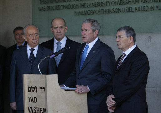 President George W. Bush makes a brief statement after his visit Friday, Jan. 11, 2008, to Yad Vashem, the Holocaust Martyrs’ and Heroes’ Remembrance Authority, in Jerusalem. Standing with him from left are: President Shimon Peres, left, of Israel; Prime Minister Ehud Olmert, of Israel, and Avner Shalev, Chairman of Yad Vashem Directorate. White House photo by Eric Draper
