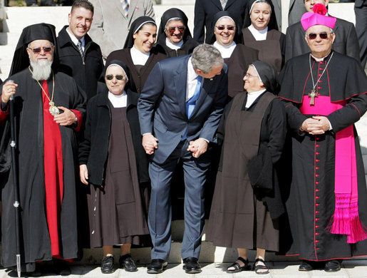 President George W. Bush pauses for a photo opportunity with nuns at the Church of the Beatitudes Friday, Jan. 11, 2008, during his last stop in Israel. White House photo by Eric Draper