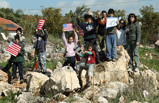 Well-wishers bearing the U.S. and Israel flags line the motorcade route Friday, Jan. 11, 2008, as President George W. Bush departed Galilee for Tel Aviv. White House photo by Eric Draper