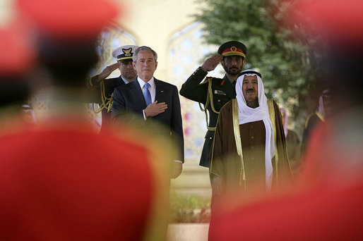 President George W. Bush and Amir Shaykh Sabah Al-Ahmed Al-Jaber Al Sabah stand for the playing of their national anthems Friday, Jan. 11, 2008, shortly after the arrival of President Bush to Kuwait City. White House photo by Chris Greenberg