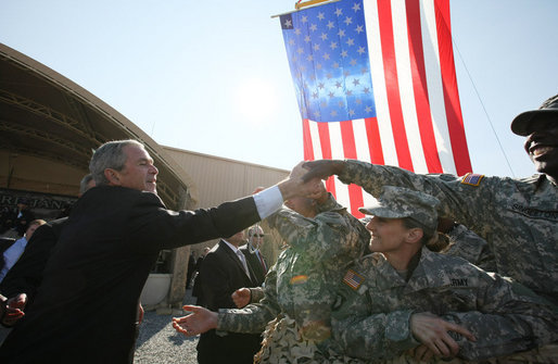 President George W. Bush reaches out to shake the hands of troops Saturday, Jan. 12, 2008, during his visit to Camp Arifjan, the last stop in his Kuwait tour before continuing on to Bahrain. White House photo by Eric Draper