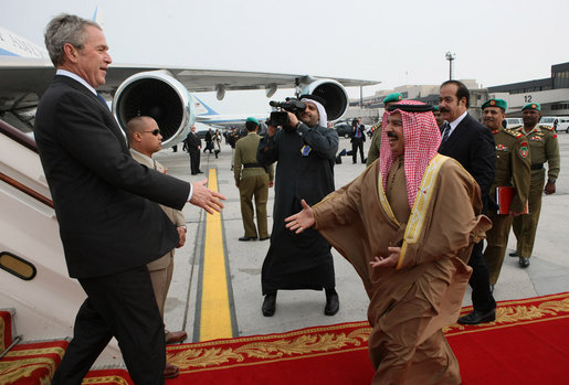 President George W. Bush reaches out to King Hamad Bin Isa Al-Khalifa as he deplanes Air Force One Saturday, Jan. 12, 2008, after arriving at Bahrain International Airport in Manama, Bahrain. White House photo by Eric Draper
