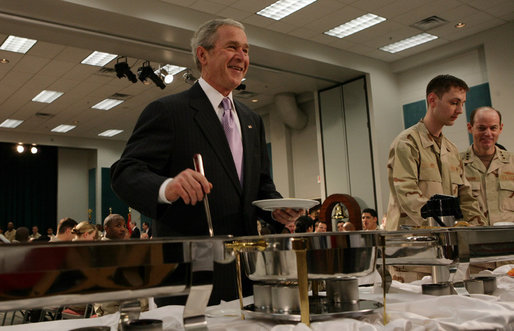 President George W. Bush serves up some breakfast for himself Sunday, Jan. 13, 2008, during a visit to the U.S. Naval Forces Central Command in Manama, Bahrain, where he visited with military personnel and coalition forces. White House photo by Chris Greenberg