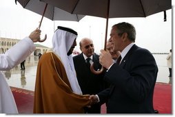 President George W. Bush is greeted by President Sheikh Khalifa bin Zayed Al Nayhan after arriving Sunday, Jan. 13, 2008, at Abu Dhabi International Airport in the United Arab Emirates. White House photo by Chris Greenberg
