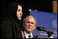 President George W. Bush is introduced Sunday, Jan. 13, 2008, by Aida Abdullah Al-Azdi, Executive Director, Emirates Center for Strategic Studies Research, before his speech at the Emirates Palace Hotel in Abu Dhabi. White House photo by Eric Draper