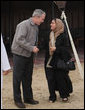 President George W. Bush shares a moment with Sheikha Lubna Khalid Al Qasimi, United Arab Emirates Minister of Economy and Planning, during dinner Sunday, Jan. 13, 2008, in the desert near Abu Dhabi. White House photo by Eric Draper