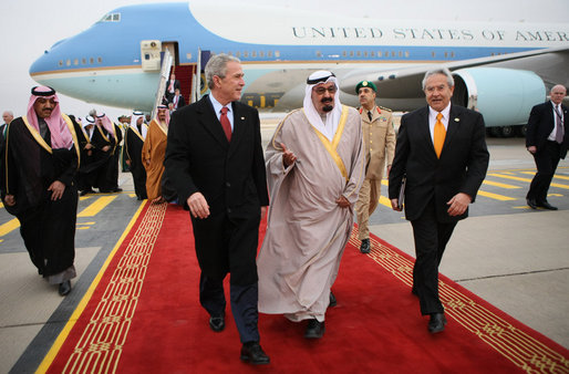 President George W. Bush and King Abdullah bin Abdul Al-Aziz walk the red carpet at Riyadh-King Khaled International Airport after the President arrived Monday, Jan. 14, 2008, in Riyadh, Saudi Arabia on the final stop of his Mideast visit. White House photo by Eric Draper